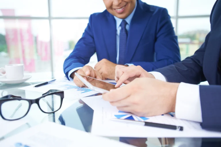 businessmen-working-with-touchpad-close-up